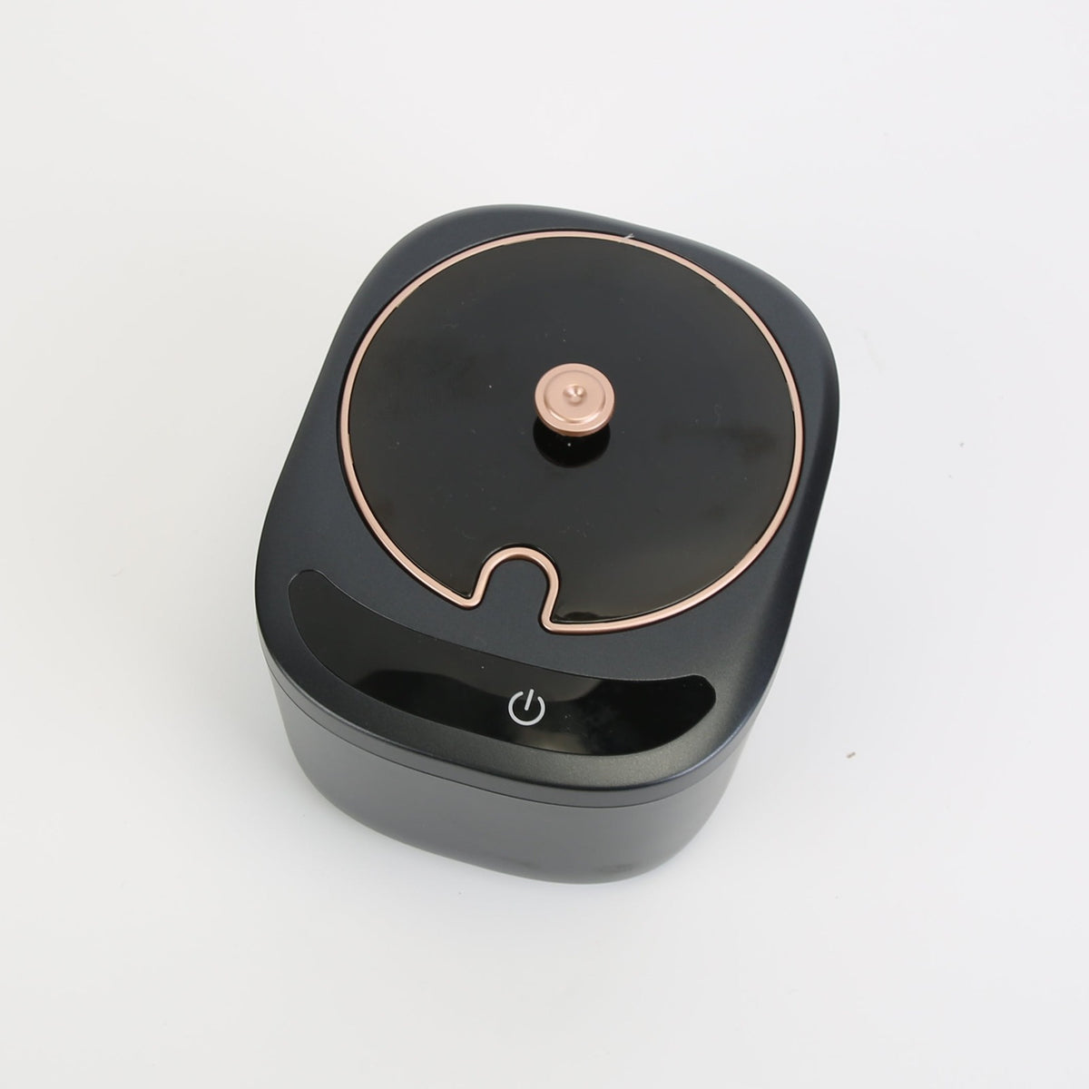 ClearCare ultrasonic retainer cleaner on a bathroom counter